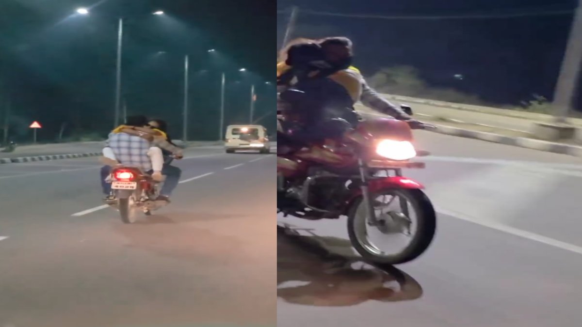 हाइवे पर कपल को चढ़ा इश्क का बुखार, VIDEO: प्रेमी की बाहों में लिपटी रही प्रेमिका और चलती रही प्यार की गाड़ी, इश्कबाजों ने यातायात नियमों को दिखाया ठेंगा